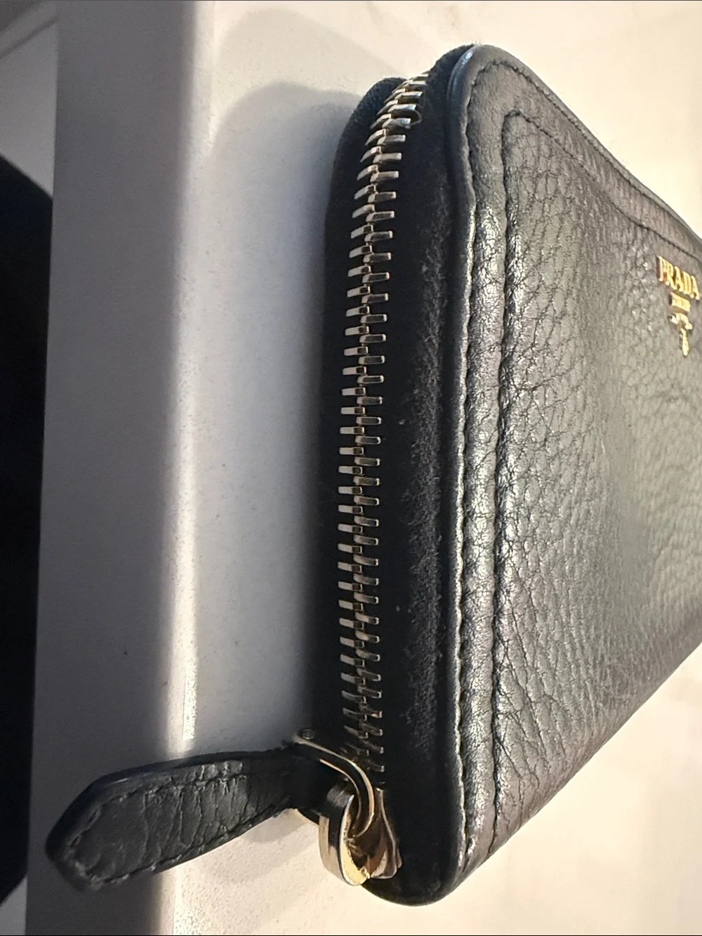 Prada Black Pebbled Leather Zip Wallet with Gold Logo